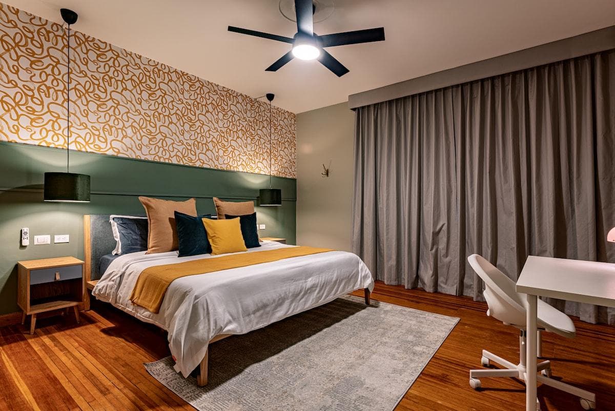 Modern bedroom with a pop of color and a sleek design for ultimate comfort