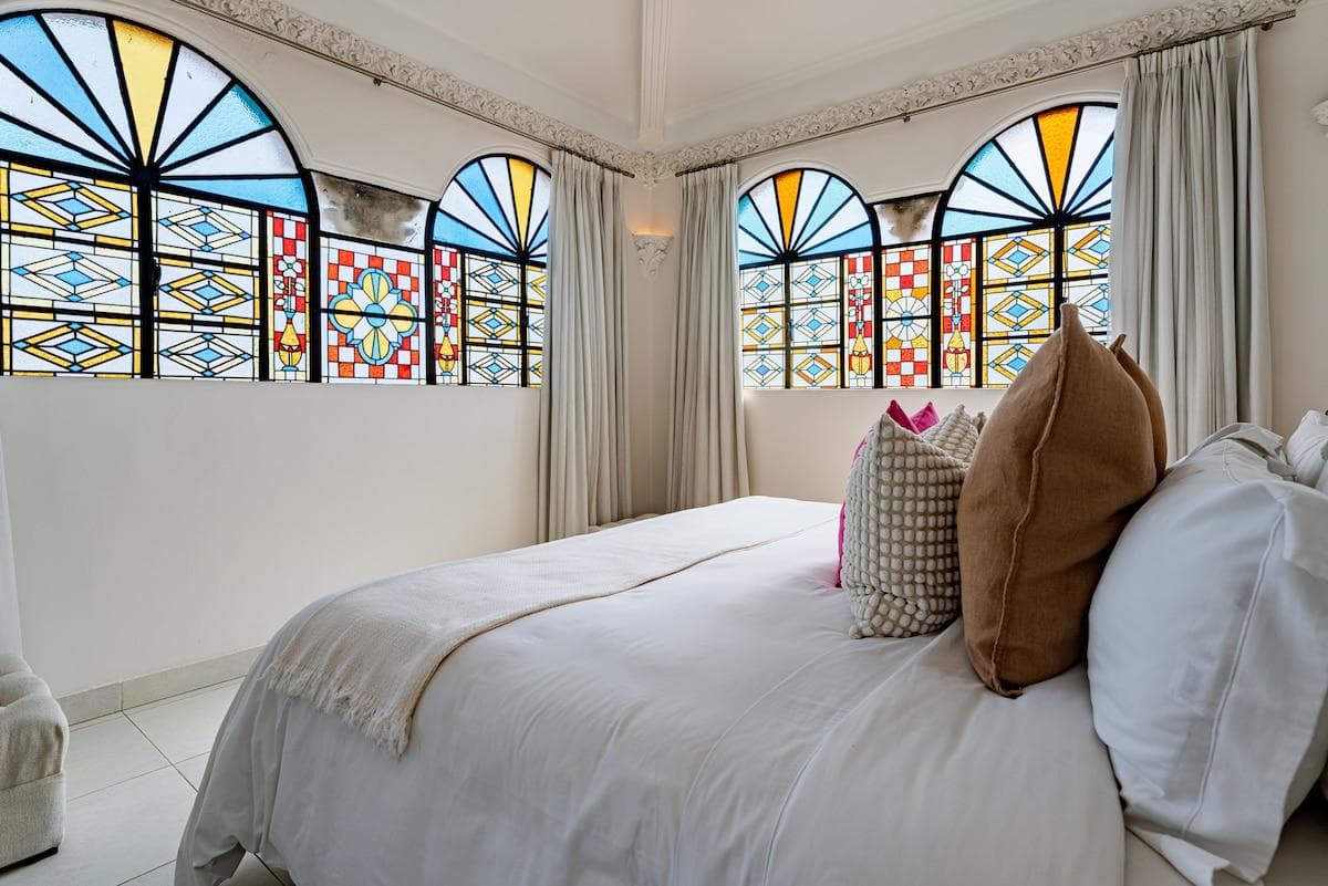 Live colonial charm with unique stained glass windows.