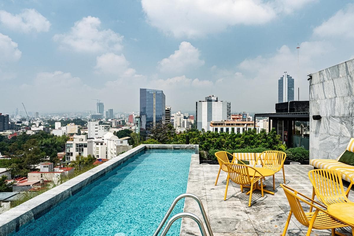 Swim, chill, and gaze: your rooftop city view spot.