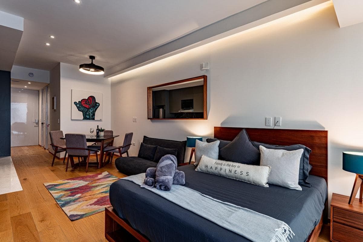 A cozy and modern studio with a vibrant touch, perfect for relaxation and comfort.