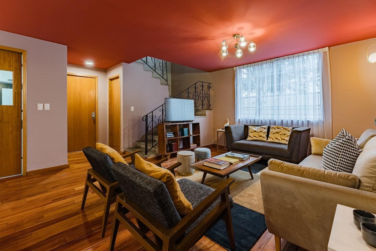 Spacious living area with modern furnishings, ideal for unwinding.