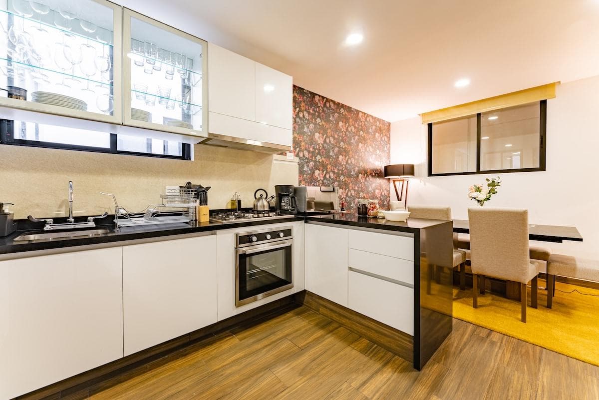 Full kitchen view with dining area, ideal for cooking and gathering