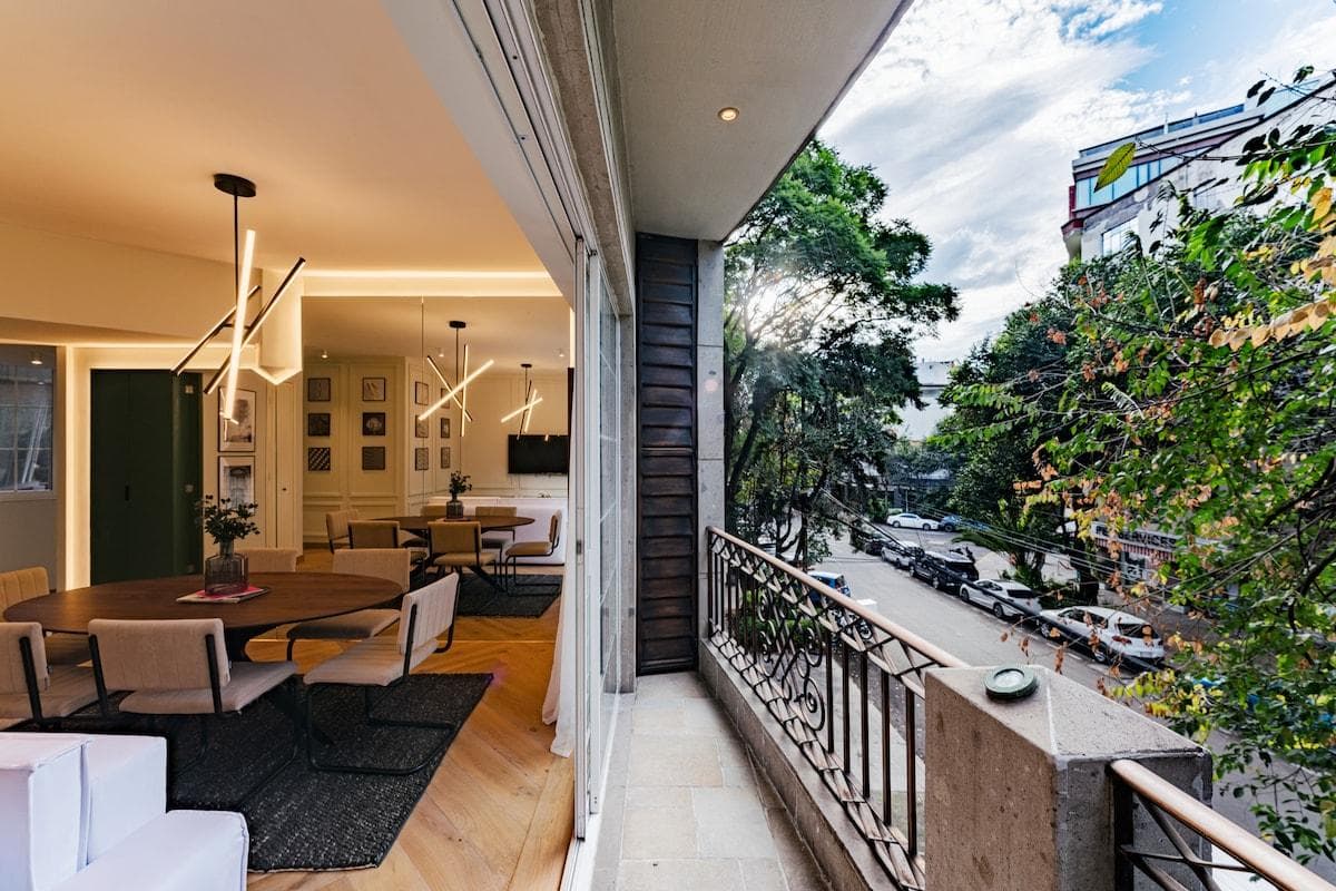 Private balcony overlooking leafy surroundings, a perfect spot to unwind.