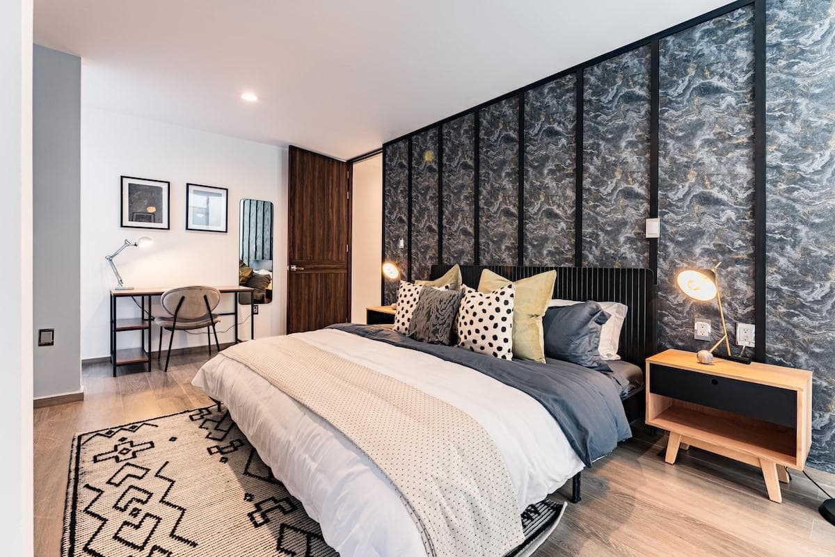 The master bedroom is a peaceful retreat with ample storage and soft lighting