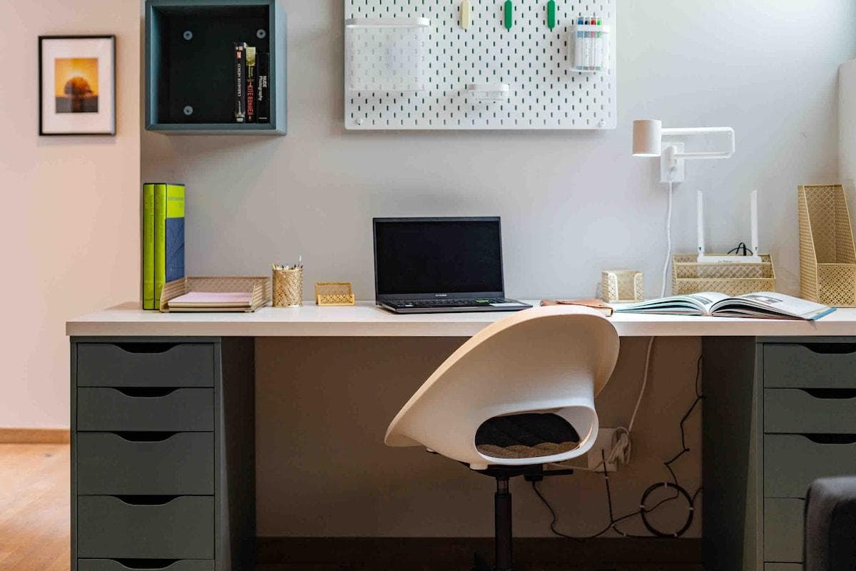 Dedicated workspace with ergonomic chair and ample lighting.