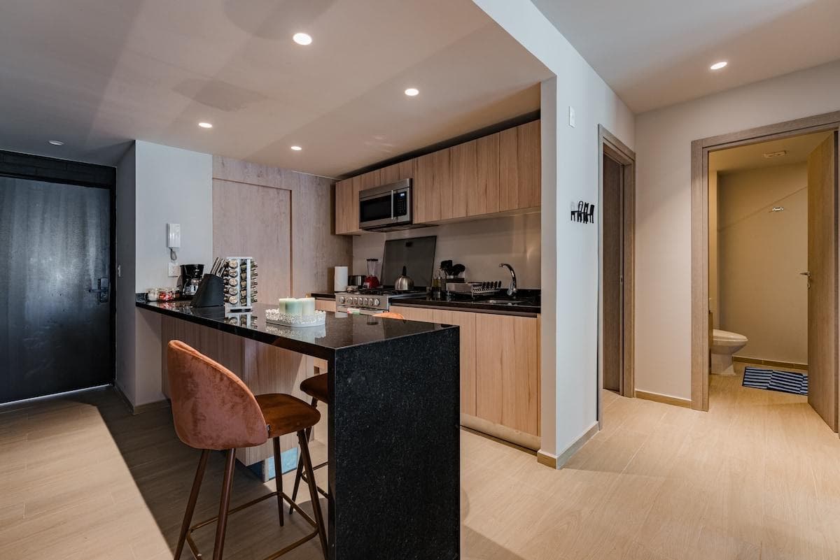 Functional kitchen with stylish finishes and convenient amenities