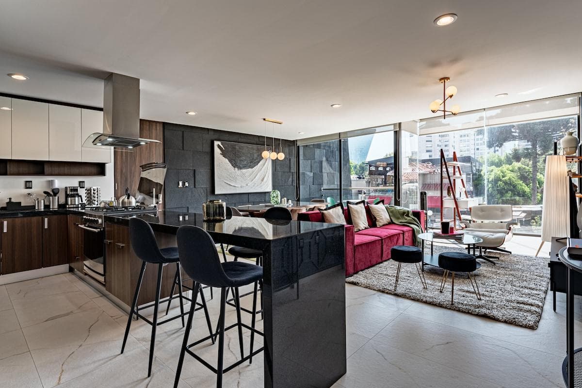Modern kitchen and breakfast bar just steps from the cozy living area