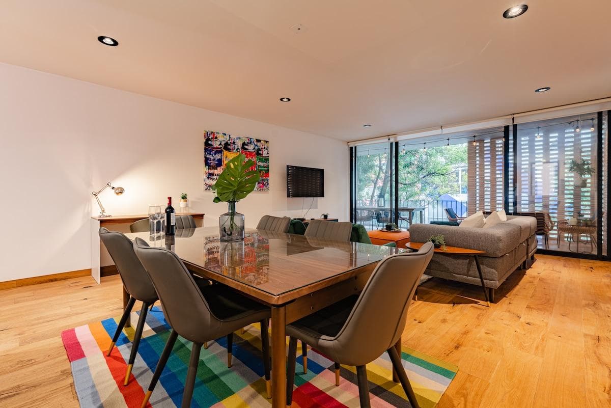 Art-filled dining area with seating for six, ideal for memorable meals.