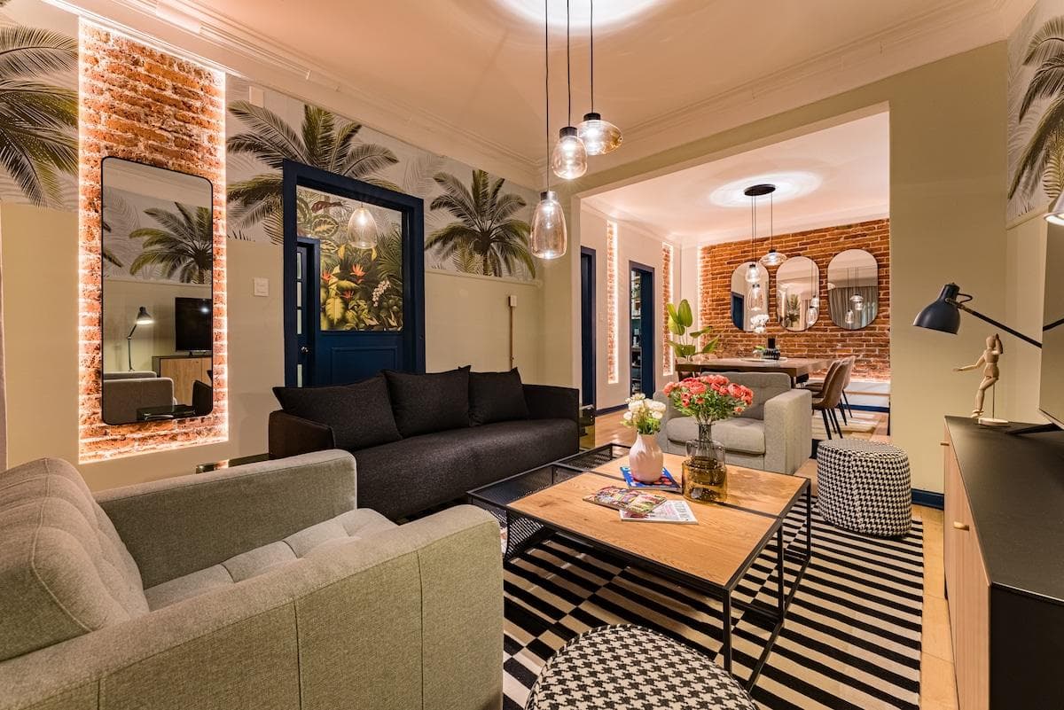 Another view of the living area showcasing cozy seating and bold accents.