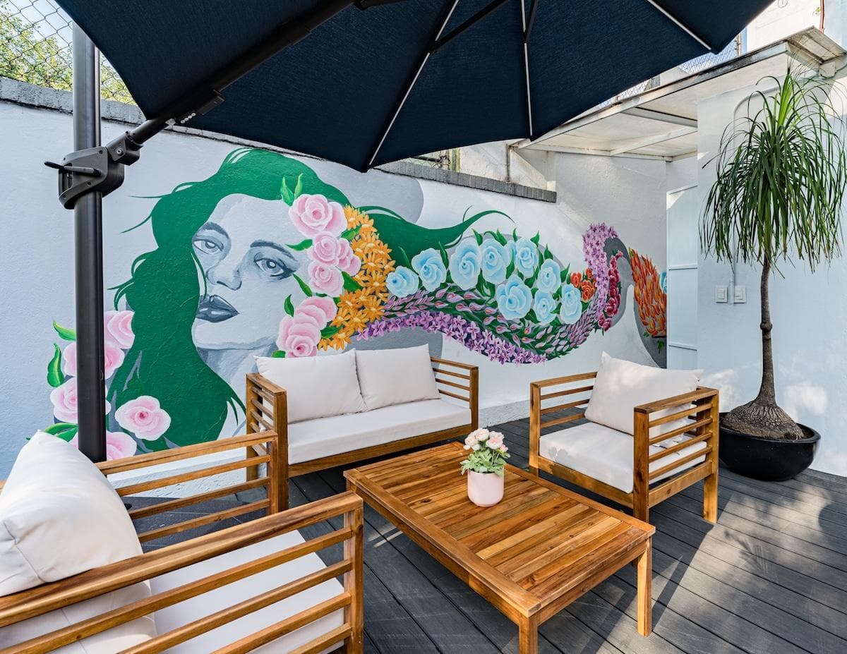 Bright outdoor seating area surrounded by greenery for ultimate relaxation.