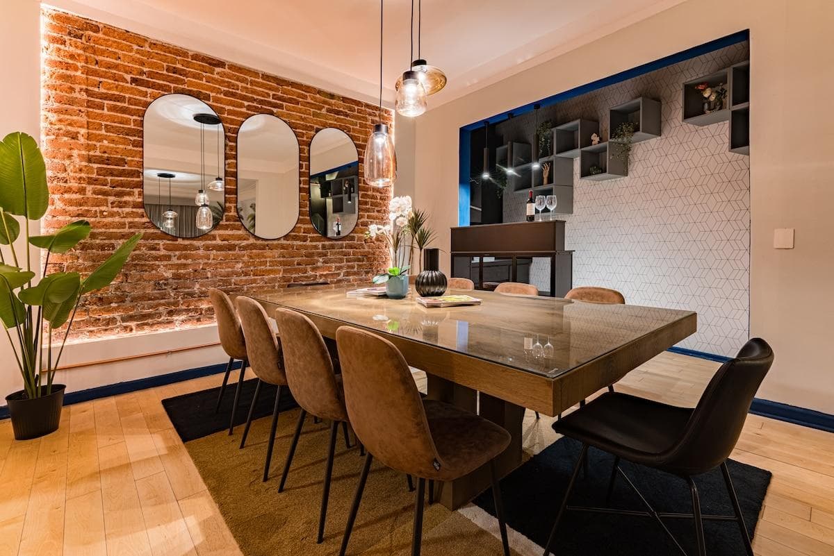 Another angle of the dining space, showcasing its sleek and inviting layout.