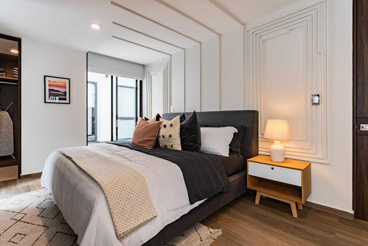 Cozy bedroom with warm tones and soft bedding for restful nights