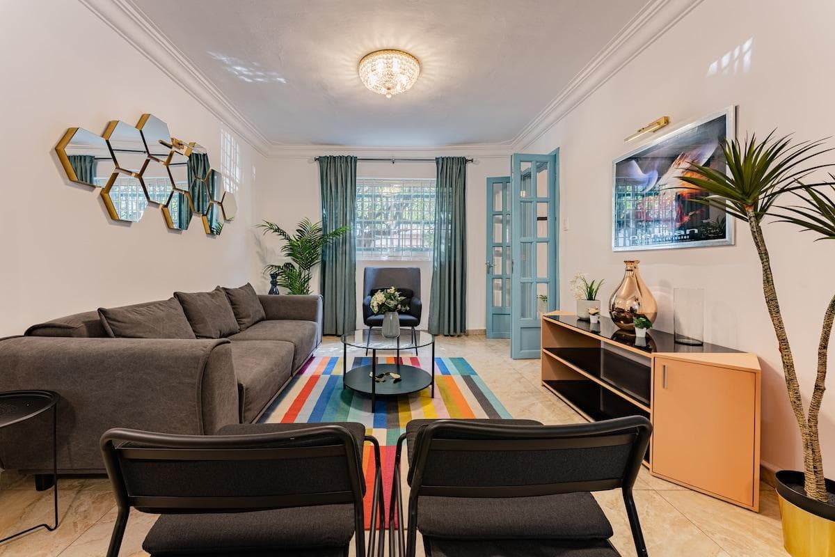 Stylish living room with eclectic decor and cozy seating options.