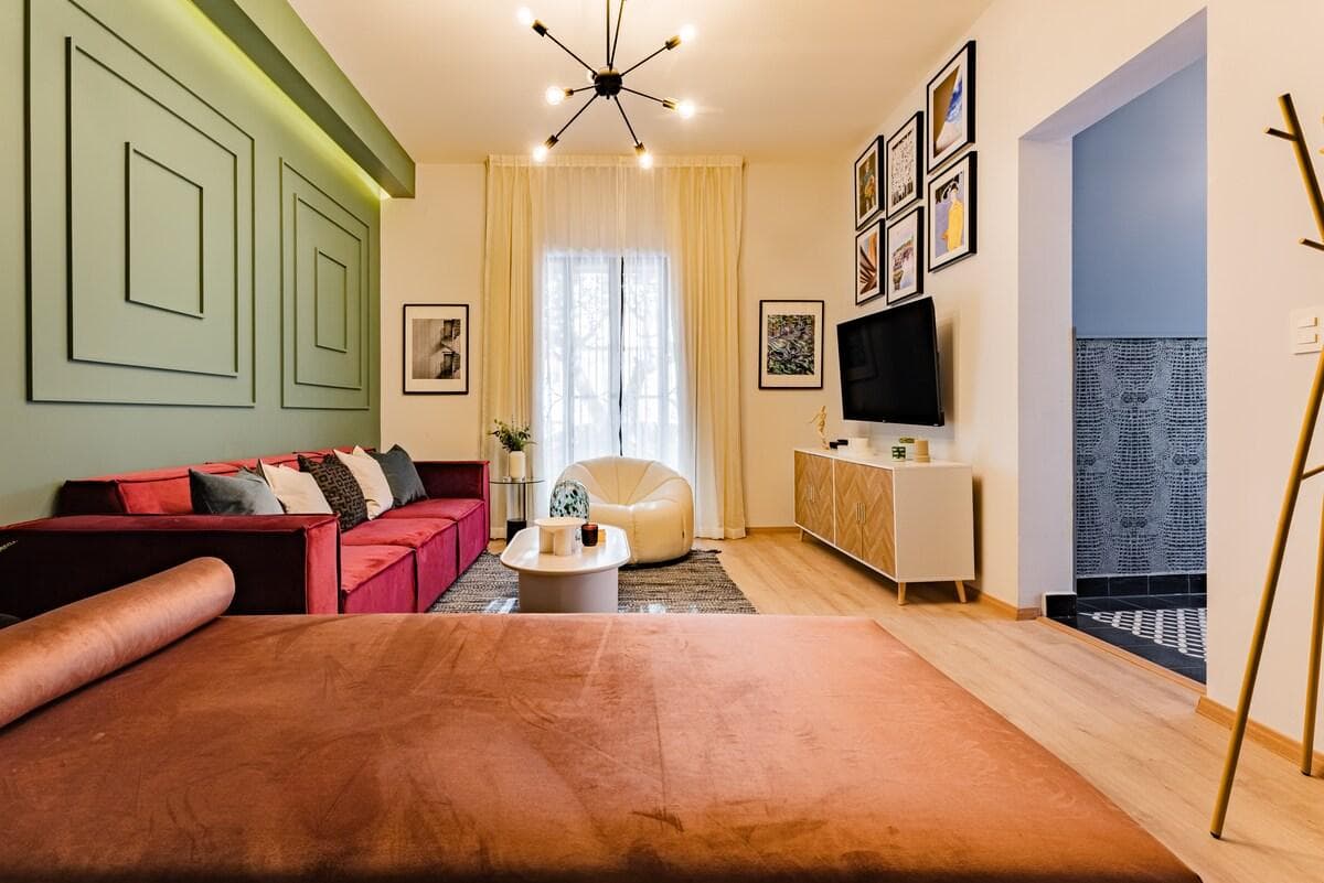 Another view of the chic living area, featuring warm wood tones and modern accents.