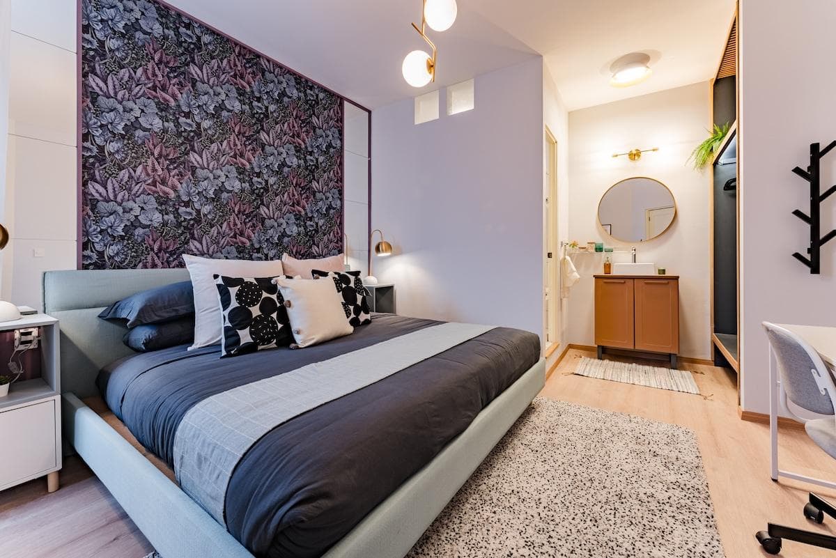 Rest easy in this stylish bedroom with a plush king bed and cozy lighting.