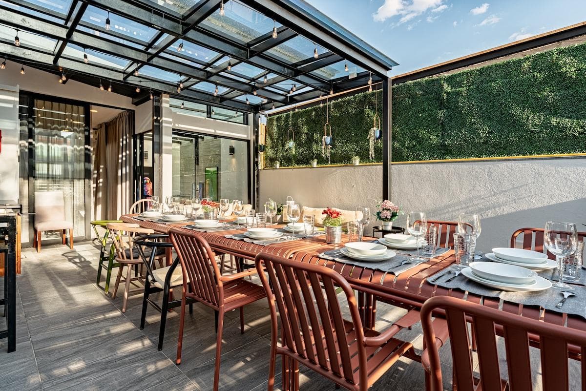 Outdoor rooftop terrace with plenty of seating, ideal for group gatherings