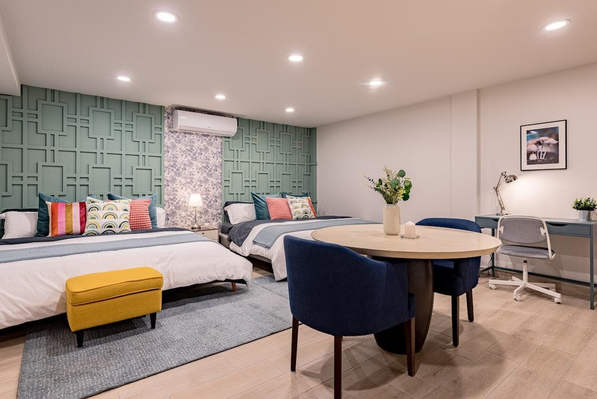 Stylish bedroom with comfy beds, ready for a restful night's sleep.