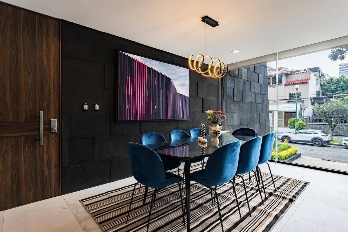 Intimate dining corner with a stylish chandelier and sophisticated decor, perfect for shared dinners.